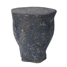 a large gray vase sitting on top of a table