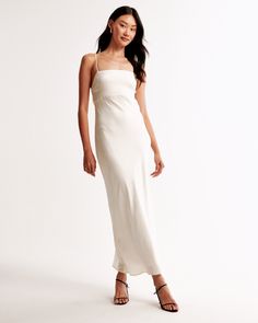 Slim-fitting maxi dress in our textured satin fabric, featuring a back-bow detail, low cowl-back detail and adjustable straps for the perfect fit! Flattering Maxi Dress, Cute Jumpsuits, Skort Dress, Style Staples, Fame And Partners, Slip On Dress, Fitted Maxi Dress, Cutout Maxi Dress, Mini Dresses Online