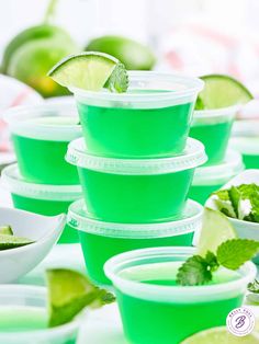 green cups with limes and mint on them