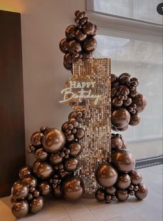 a birthday cake made out of balloons