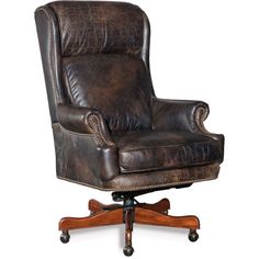 an old leather office chair sitting on top of a wooden desk with casteor wheels