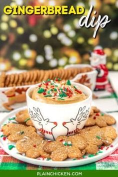 gingerbread dip in a mug surrounded by cookies and crackers