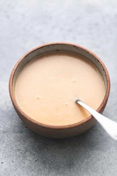 a bowl of soup with a spoon in it