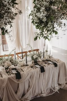 Black and white table setting with wedding drapes, black taper candles, white flowers at Willow Grange Farm Black White Table Setting, Wedding Table White, Retro Wedding Cakes, Chic Wedding Table, White Table Setting, Black White Table, White Table Settings, Black Taper Candles, Honeymoon Fund