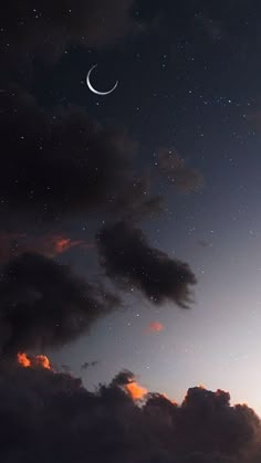 the night sky is filled with stars and clouds as the moon shines in the distance