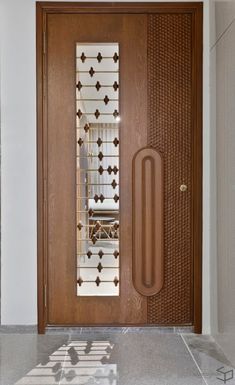 a wooden door with decorative glass inserts