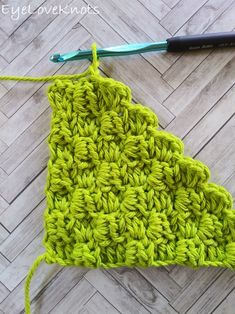 the crochet triangle is being worked on