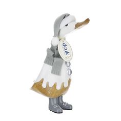 a duck figurine with a tag on it's neck, wearing a dress