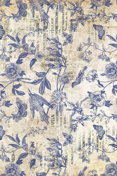 an old paper with blue flowers and birds on it