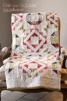 a chair with a quilt on it and the words fair and square written in white