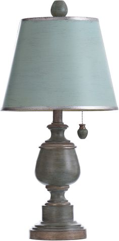 a lamp that is sitting on top of a wooden base with a light blue shade