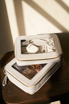 a white case sitting on top of a wooden table