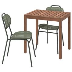 a table and two chairs with one chair up against the other, both in different colors