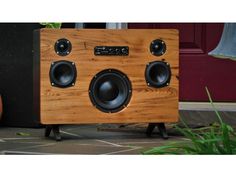 a wooden speaker sitting on top of a table