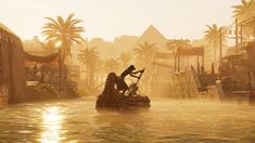 a person on a boat in the water with palm trees and buildings behind them,