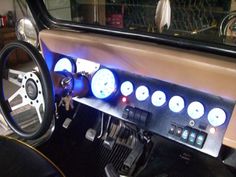 the interior of a car with gauges and dash lights