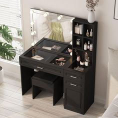 a black vanity table with drawers and lights