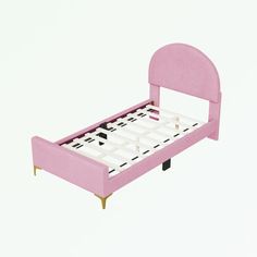 a pink bed frame with wooden slats and white sheets on the bottom, in front of a white background