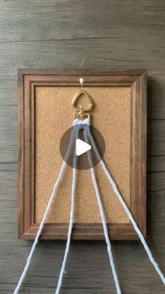 a cork board with rope hanging from it's end and a video about how to use the loop