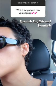 a woman wearing sunglasses is sitting in the back seat of a car with her head up