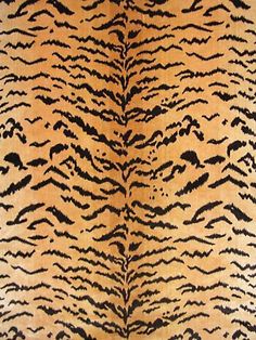 an animal print fabric with black and brown stripes