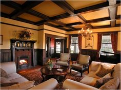 a living room filled with furniture and a fire place