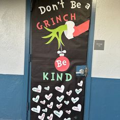 a door decorated with hearts and the words don't be grinch be kind