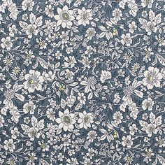 a blue and white flowered background with lots of small flowers on the bottom half of it