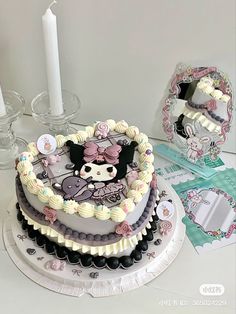 there is a cake that has been decorated with many different things on the top and bottom