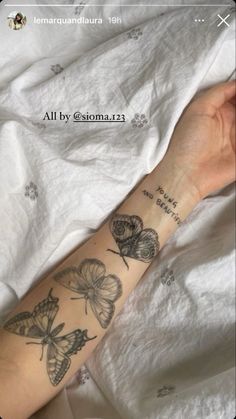 a woman's arm with butterflies on it and the words, all by gesorman