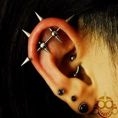 a woman with piercings on her ear