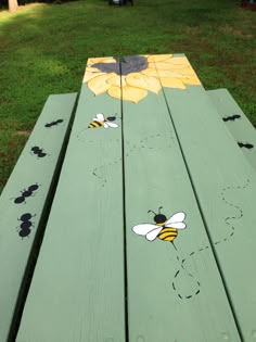 painted wooden bench with bees and sunflowers on it