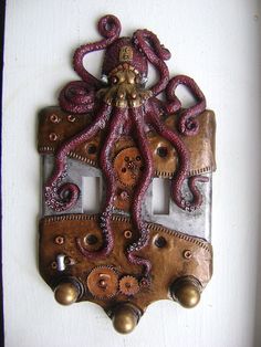 an octopus is sitting on top of a light switch