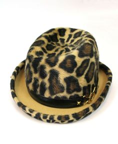 DESCRIPTION This is an absolutely fabulous vintage hat from the 70s made by Yves Saint Laurent in a hard to come by style.  The hat is made out of a velvety soft fur felt that has a leopard print design done in dark brown, black, and light brown.  The hat has an upturned bumper brim that also has a leopard print on it.  There is a black leather hat band with a gold tone metal accent on one side.      SIZING The hat does not have a size tag, but I believe it would best fit a size Medium.  I perso Vintage Fur Felt Fedora For Fall, Retro Winter Fedora With Curved Brim, Vintage Winter Fur Felt Hat, Vintage Fur Felt Hat For Winter, Vintage Fur Felt Fedora, Winter Retro Cloche Hat With Short Brim, Retro Flat Brim Fedora For Winter, Retro Winter Cloche Hat With Short Brim, Retro Winter Fedora With Flat Brim