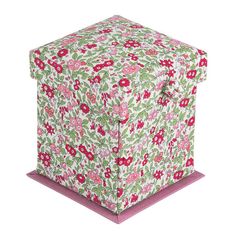 a pink and green box with flowers on it