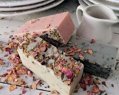 a piece of cake sitting on top of a table next to a cup and saucer