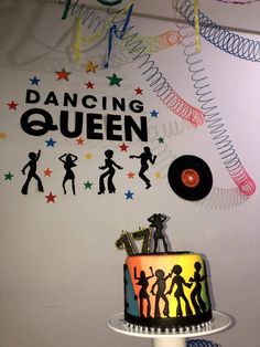 there is a cake that has been decorated with dancing queen on it and the words'dancing queen'above it