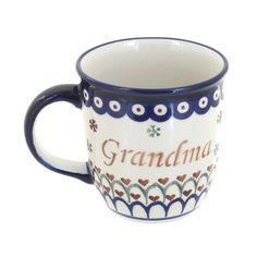 a blue and white coffee cup with the word grandma on it's side, sitting in front of a white background