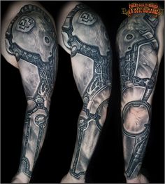 two tattoos on the legs of men with chains and keys in them, both are black and white