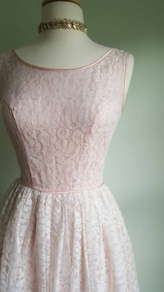 Dreamy, blush pink lace and feather-light flounce, flounce, flounce. 💖🌸This vintage party dress features a princess-seamed bodice and a nipped waist that flares to an ultra-full skirt for a flattering fit; a feminine, scooped neckline; pink satin piping trim; a soft pink lining that peeks through blush-pink lace; and a built-in tulle and crinkle cotton-gauze petticoat for fullness and elegance. Back metal zip; pictured on a US size 2/4 dress form. This gown arrives freshly cleaned and ready to Light Pink Vintage Dress, Vintage Flower Dress, Elegant Pink Dress With Delicate Lace, Feminine Lace Dress With Lace Bodice For Weddings, Feminine Lace Bodice Dress For Wedding, Pink Scalloped Lace Dress For Garden Party, Pink Lace Dress With Lace Bodice For Party, Pink Lace Bodice Dress For Party, Pink Lace Dress With Lace Bodice For Prom