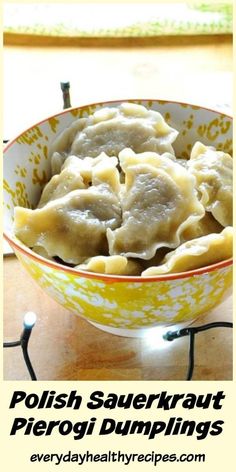 polish sauerkraut pierogi dumplings in a yellow and white bowl