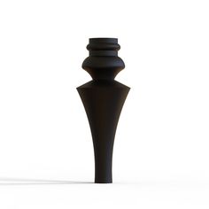 a tall black vase sitting on top of a white floor