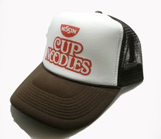 Cup of Noodles Trucker Hat Mesh Hat Vintage Snapback Hat Brown Vintage style trucker hat This is a mesh trucker hat with an adjustable snapback that fits most people 100% Polyester Front 100% Nylon Mesh Back 5-Panel cap Seamless Foam Front Panel with Lining 8 Rows Stitching on Visor Matching Fabric Under visor Adjustable Plastic Snap Hats Trendy, Nissin Cup Noodles, Snapback Hats Men, Vintage Trucker Hat, Brown Hat, Vintage Trucker Hats, Cup Noodles, Brown Hats, Mesh Hat