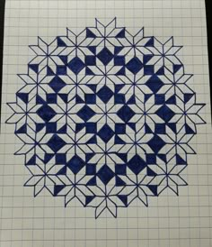 a blue and white drawing on top of a sheet of paper with squares in the middle