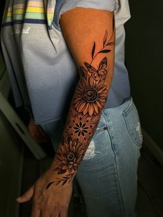 a woman with a tattoo on her arm