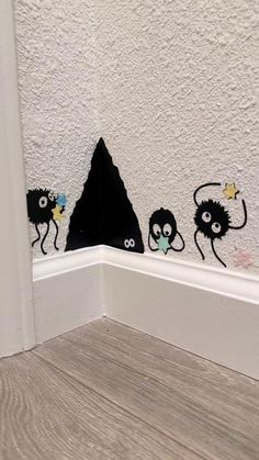 the corner of a room with some stickers on it