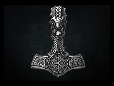 an old style hammer with intricate designs on it's head and neck, against a black background