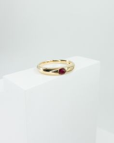 18k solid yellow gold sleek high shine slim dome ring featuring one natural pigeon blood ruby stone ruby weight 0.154ct ring band width 3.3mm to 2.1mm total weight 2.3g size 5.5 in stock Yellow Gold Ruby Signet Ring With Polished Finish, Formal Gold Stackable Ruby Rings, Formal Stackable Round Ruby Ring, Formal Stackable Ruby Ring, Classic Gold Stackable Ruby Ring, Yellow Gold Ruby Signet Ring For Anniversary, Oval Stackable Ruby Ring In Yellow Gold, Gold Ruby Ring With Polished Round Band, Gold Ruby Ring With Polished Finish