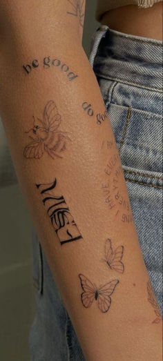 a woman's arm with butterflies on it and the word hello written in cursive writing