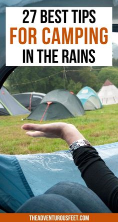 someone holding their hand out in front of tents with text overlay that reads 27 best tips for camping in the rains